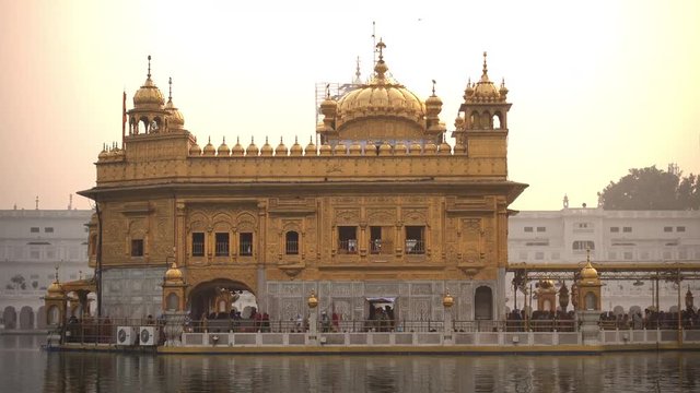 Video of Sikh pilgrims in the Golden Temple at sunset during celebration day in December in Amritsar, Punjab, India. Harmandir Sahib is the holiest pilgrim site for the Sikhs.
