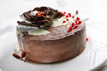 Round Whole Chocolate Cake Decorated with Dark and White Chocolate Close Up