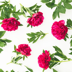 Floral composition with red peony flowers on white background. Flat lay, top view.