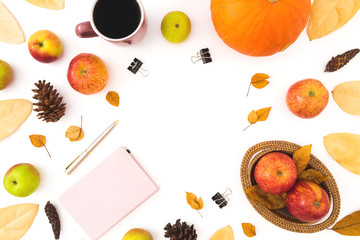 Thanksgiving dinner frame made of fall leaves, pine cones, mug of coffee, pink diary and apples with pumpkin on white background. Flat lay, top view
