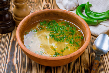 Chicken soup bouillon in a plate