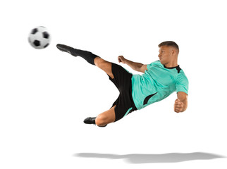 soccer player kicking the ball in the air isolated on white