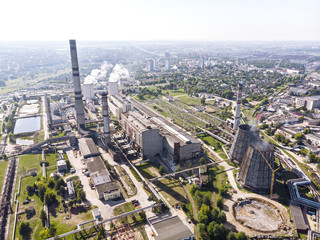 aerial top view of city heat power plant against blue sky background