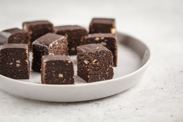 Chocolate nuts halva with honey. Healthy vegan food concept.