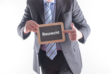 Anwalt mit einer Tafel Bau Recht