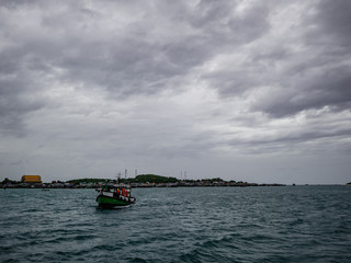 Amazing idyllic ocean and beautiful sky with island view and boat in vacation time