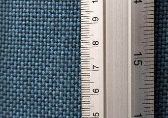 Close-up Ruler on blue fabricboard with copy space