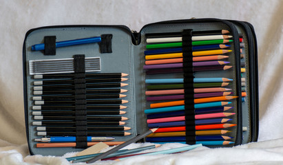 art supplies with colored pencils