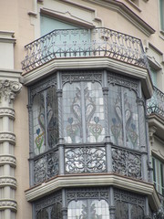 Obraz premium Fragment of the facade of a beautiful house with glazed balconies