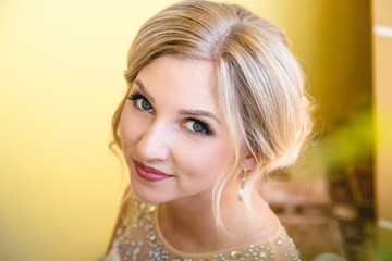 Beautiful blonde bride waiting her groom in wedding day