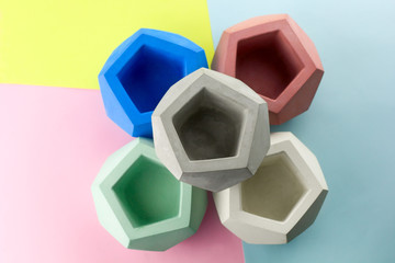 concrete pot for plants ,empty ,polygonal shape,bright background