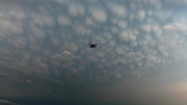 Aerial view mammatus clouds behind drone