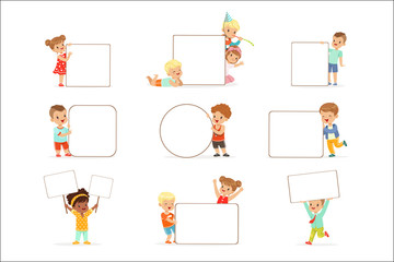 Smiling kids standing with white blank boards set. Happy little boys and girls in casual clothes holding empty posters vector illustrations