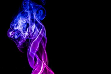 Obraz premium Colored smoke on black background