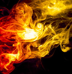 Fototapeta premium Colored smoke on black background