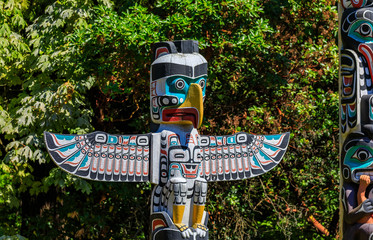 First Nations American Indian thunderbird totem pole in Stanley Park in Vancouver Canada - obrazy, fototapety, plakaty