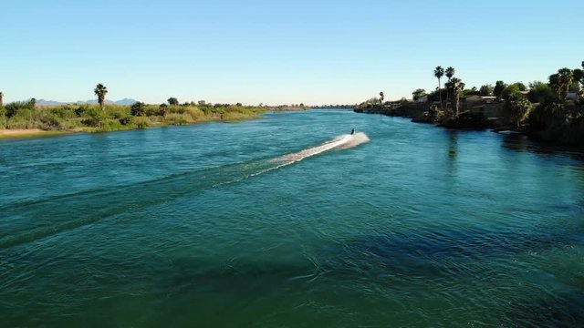 Aerial view of the Colorado river. California Arizona Border.  Riding jet ski, water scooter. From above, drone shot
