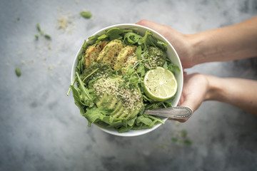 Obraz premium Green Fitness Breakfast Veggie Bowl with Falafel and Avocado