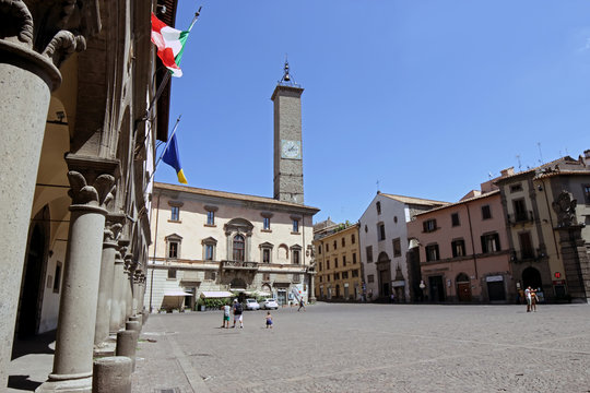 Palazzo Podestà with clock tower at Plebiscito square in Viterbo, Italy