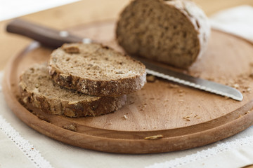 Fototapeta na wymiar Fresh tasty wheat wholegrain brown bread with pumpkin seeds