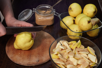 The man cooks quince jam