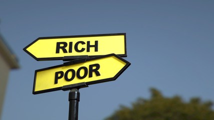 A road sign with rich poor words. 3d image.