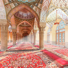 Obraz premium The Nasir ol Molk Mosque. Arabic arches and ornaments in the interior. Moroccan interior. 