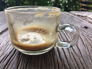 Empty of glass hot espresso coffee on wood table