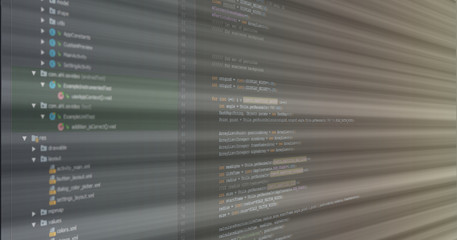 Software development concept. Screen of lines of source code on IDE with ray light which leads to success achievement.