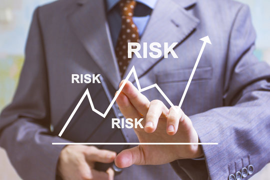 Businessman Presses Risk Chart Diagram On Virtual Digital Electronic User Interface In Internet