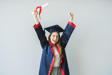 Young female student graduating from university