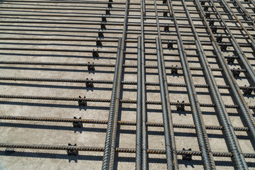 Reinforcing rods laid on the plastic clips to ensure the required concrete cover.