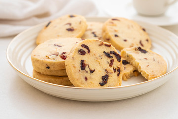 Christmas round cookies with walnuts and dried cranberries. Selective focus. Copy space.