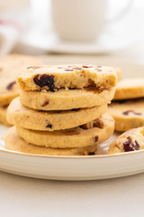 Christmas round cookies with walnuts and dried cranberries. Selective focus. Copy space.