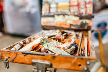 group of old metallic paint tube on the easel