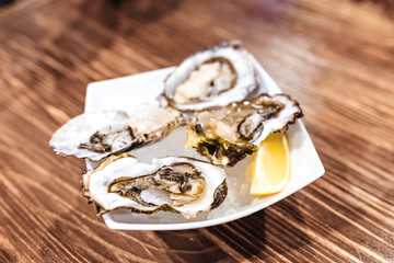 Oysters as served with lemon in a restaurant