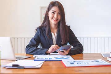 Beautiful young asia woman working in office.