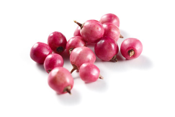 pink peppercorns isolated