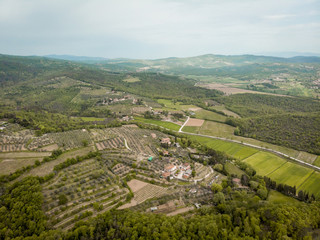 Fototapeta na wymiar aerial view of fields and hills with trees in arezzo province, Italy