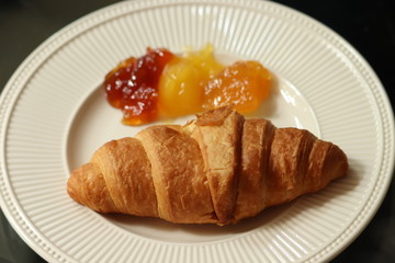 Fresh croissant, lemon curd and marmelade