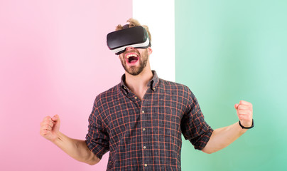 Win game. Man unshaven guy with VR glasses involved in cyber space, pink background. Hipster use modern technologies. Cyber space. Guy VR glasses head mounted display interact in cyber space