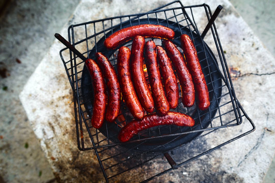 Grilled Sausages Grill Flames Smoke Top View BBQ Background