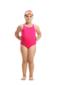 Little girl in a swimming suit, cap and googles