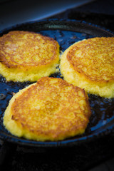 potato pancakes in a frying pan