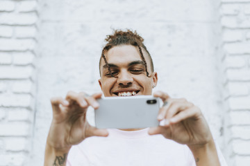 Man taking a selfie in downtown