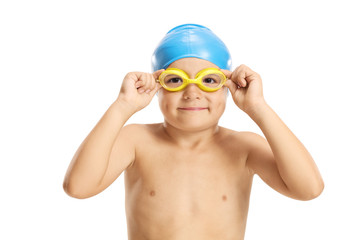 Portrait of a boy with a swimming cap and googles