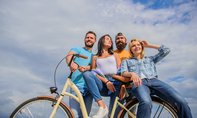 Share or rental bike service. Company stylish young people spend leisure outdoors sky background. Bicycle as best friend. Cycling modernity and national culture. Group friends hang out with bicycle