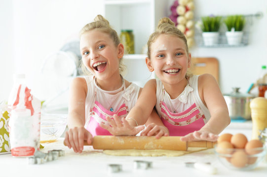 Portrait of a two sisters in the kitchen