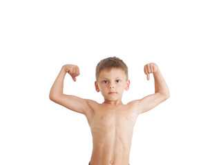 healthy strong little caucasian boy showing his biceps muscles on white isolated backdrop