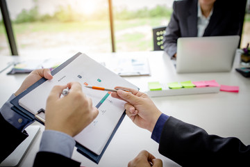 Teamwork process, business people working in the office discussing documents and ideas at meeting
